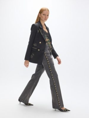 Jeans con tachas y cinturón LOLA CASADEMUNT